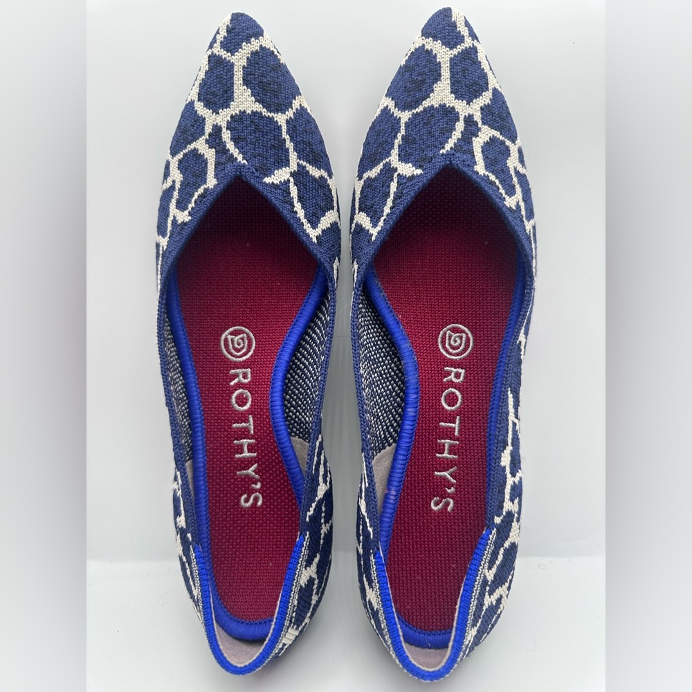 Retired Htf Rothy's point Flats in indigo giraffe Size 7